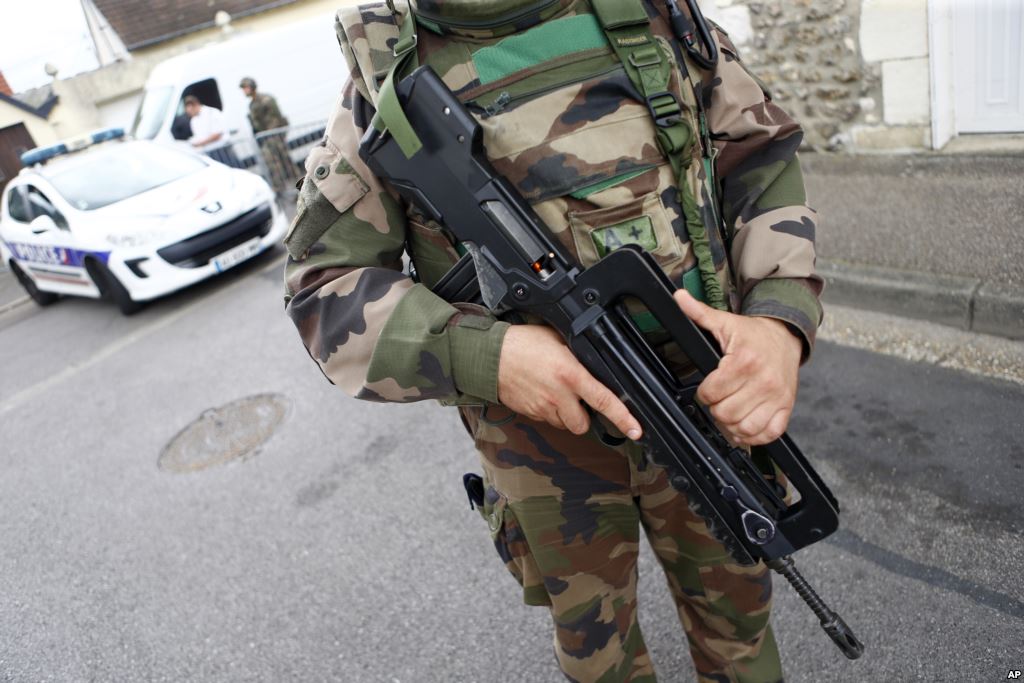 A French soldier stands guard while preventing the access to the scene of an attack in Saint-Etienne-du-Rouvray Normandy France