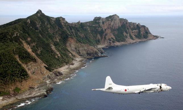 A Japanese surveillance plane flies over the disputed islands in East China Sea