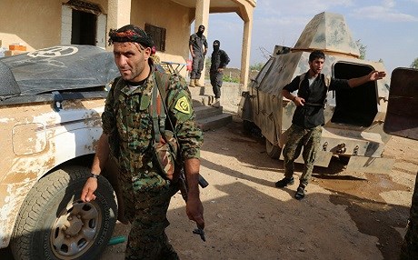 A Kurdish member of the Syrian Democratic Forces in Manbij