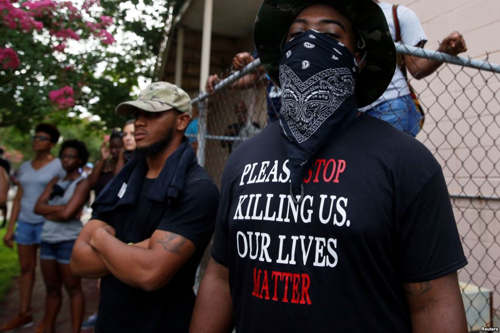 A demonstrator stands during protests in Baton Rouge Louisiana U.S