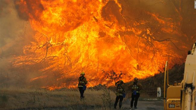 A hillside erupts in flame in Placerita Canyon in Santa Clarita California July 25