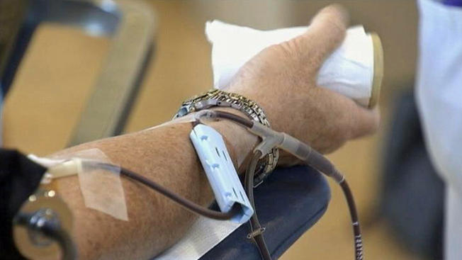 A man donates blood in this file image