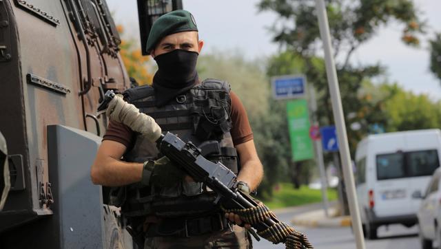 A member of the police special forces stands guard in front of the air force academy in Istanbul Turkey