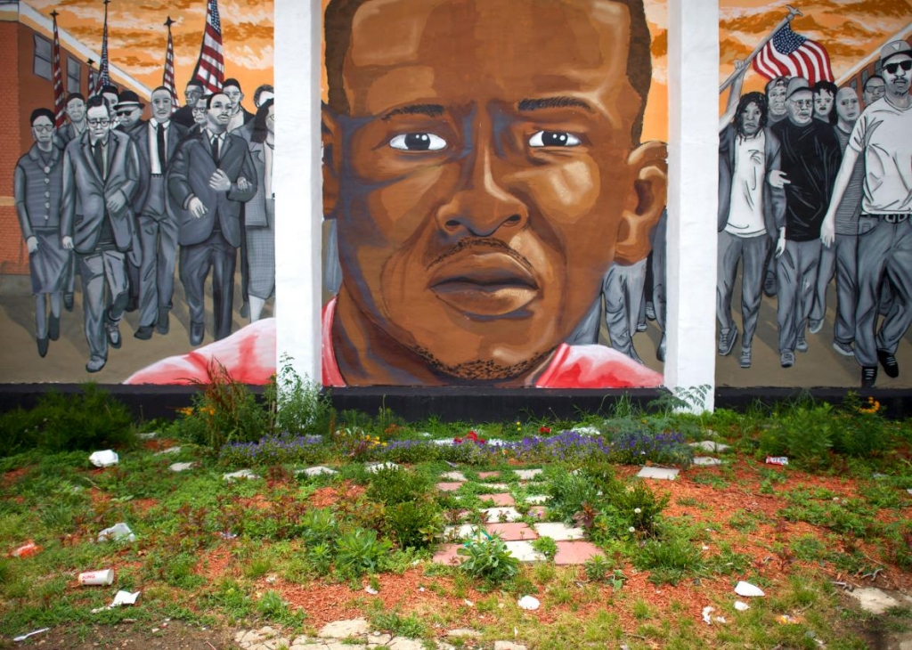 542519130-trash-collects-below-a-mural-of-freddie-gray-after