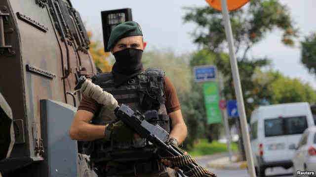 A police special forces member stands guard on a street in Istanbul Turkey