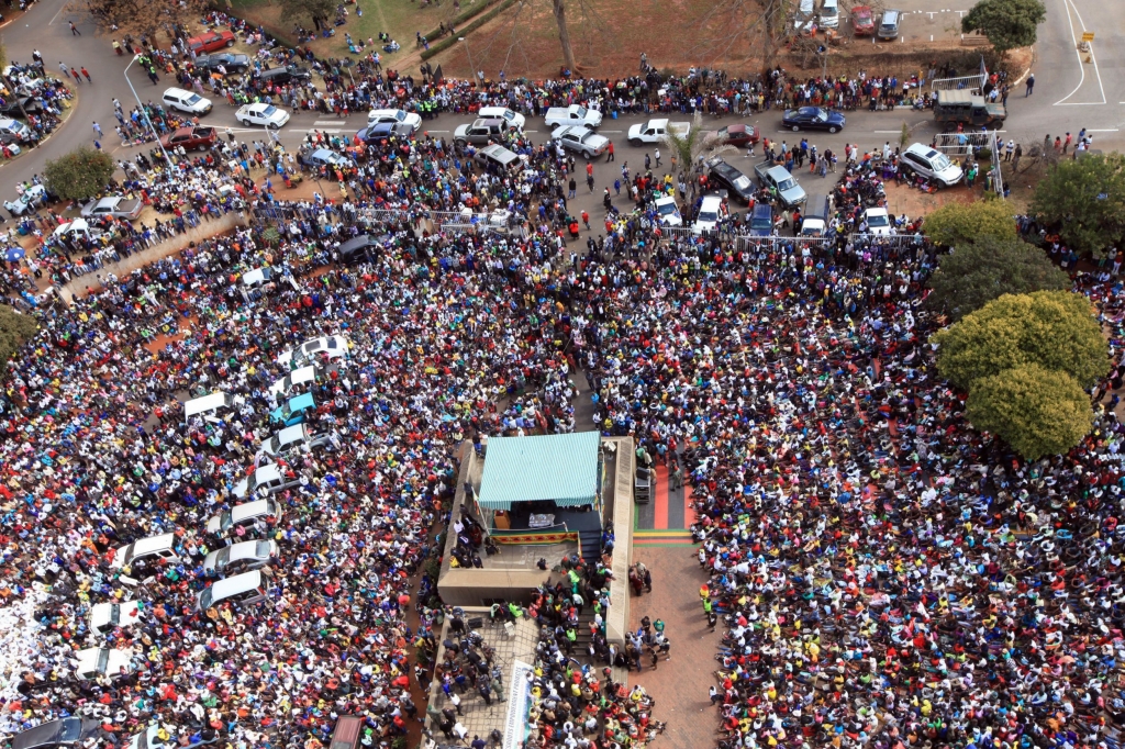 Thousands of Mugabe supporters gather at the party headquarters in Harare Wednesday July 20 2016. Tens of thousands of supporters of Zimbabwe's ruling party are marching in the capital in response to a series of recent protests against the govern