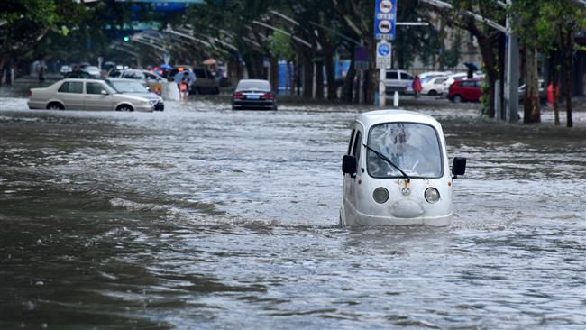 A vehicle is seen passing a flooded street in Handan Hebei Province China