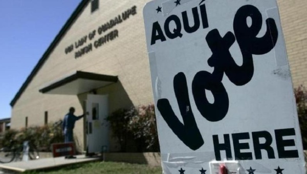 A voter enters a polling station to cast his vote in the Texas Primary in Seguin