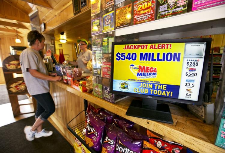 A winning ticket for the $540 million Mega Millions jackpot was sold in Indiana. Above a lottery sign in Maine