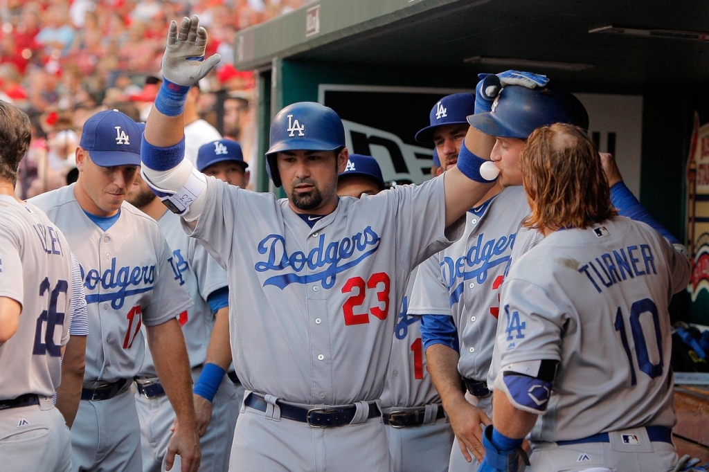 Adrian Gonzalez celebrates his grand slam in the first inning on Sunday night