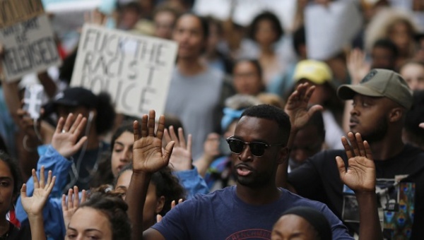 People protest against the killing of Alton Sterling and Philando Castile during a march along Manhattan