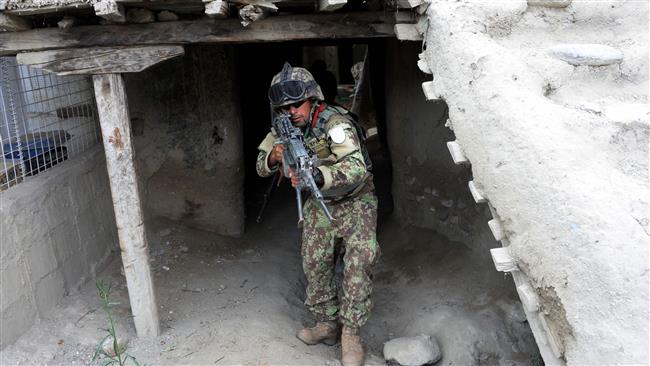 A member of the Afghan security forces takes part in a patrol during clashes with the Takfiri Daesh terrorists in Kot Nangarhar province