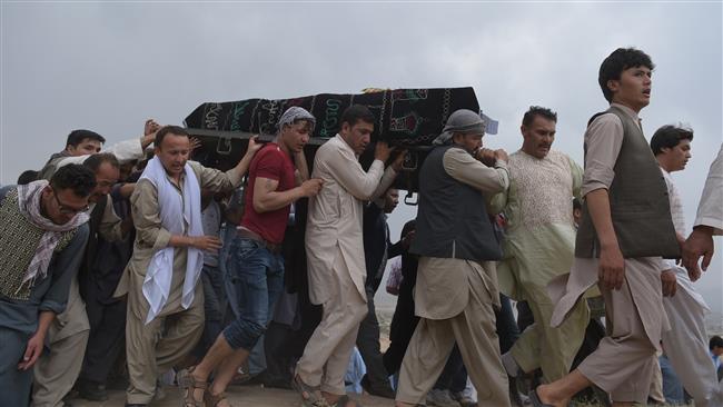 Afghan mourners carry the coffin of one of the 80 people killed in a twin suicide attack in Kabul