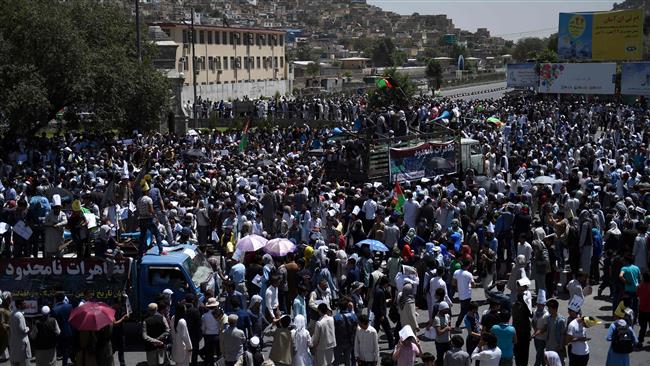 Afghan protesters shout anti-government slogans during a demonstration in Kabul