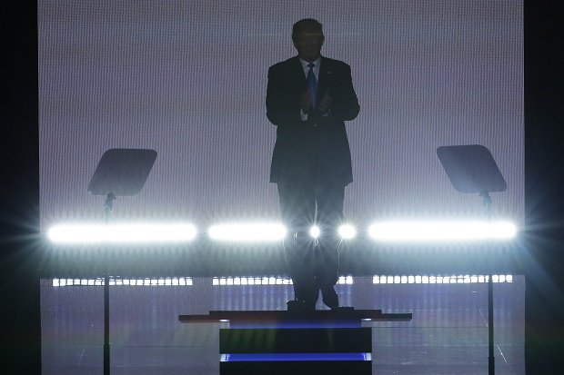 Republican Presidential Candidate Donald Trump applauds as he steps to the podium to introduce his wife Melania during the opening day of the Republican National Convention in Cleveland Monday