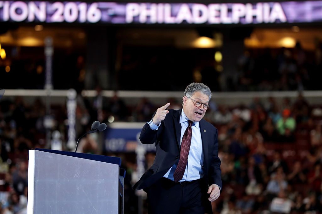 Sen. Al Franken gestures to the crowd as he delivers remarks on the first day of the Democratic National Convention at the Wells Fargo Center