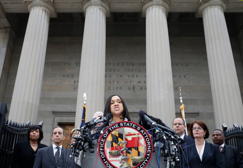 Baltimore state attorney Marilyn Mosby speaks on recent violence and says there is'probable cause to file criminal charges in the Freddie Gray case of officers involved in the arrest of the black man who later died of injuries he sustained while in cus