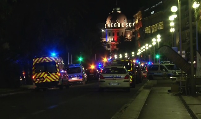 Ambulances and police cars attend the scene of the attack in Nice