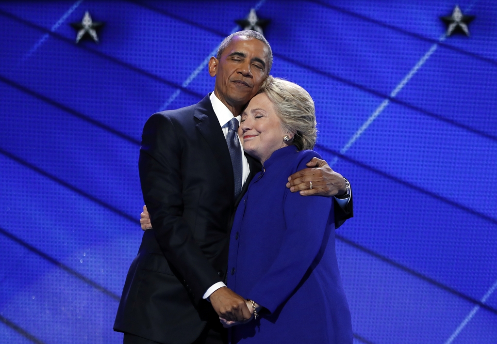 President Barack Obama hugs Democratic Presidential candidate Hillary Clinton after addressing the delegates during the third day session of the Democratic National Convention in Philadelphia Wednesday