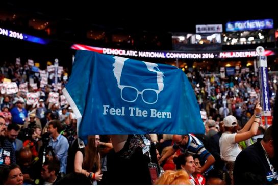 A delegate shows support for former Democratic Presidential candidate Sen. Bernie Sanders I-Vt. during the first day of the Democratic National Convention in Philadelphia, Monday