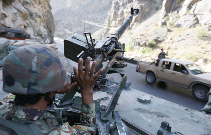 An Afghan soldier greets to other soldier in Kabul Jalalabad highway on the outskirts of Kabul Afghanistan in this file