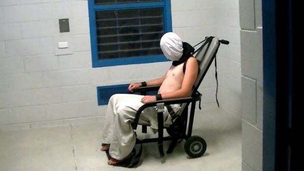 An image from the Four Corners program of boy strapped to a chair