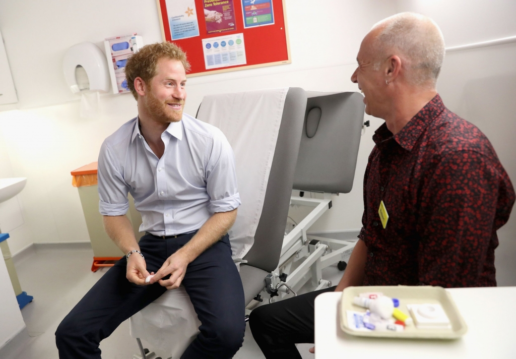 Prince Harry prepares to have a HIV test taken by Specialist Psychotherapist Robert Palmer during a visit to the Burrell Street Sexual Health Centre in Southwark London where he is highlighting the fight against HIV and AIDS. PRESS ASSOCIATION