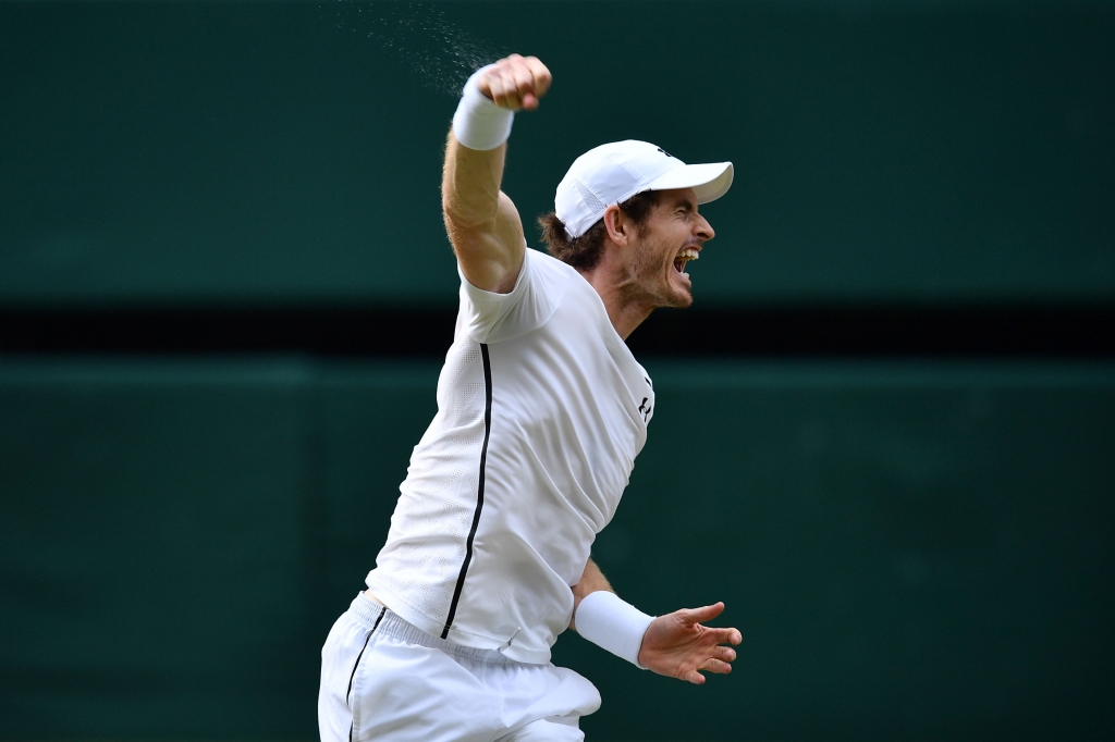 Britain's Andy Murray celebrates beating Canada's Milos Raonic during the men's singles final match on the last day of the 2016 Wimbledon Championships at The All England Lawn Tennis Club in Wimbledon southwest London