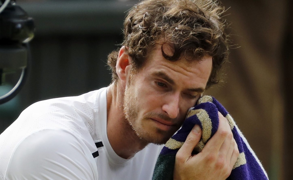 Andy Murray of Britain cries after beating Milos Raonic of Canada in the men's singles final on the fourteenth day of the Wimbledon Tennis Championships in London Sunday