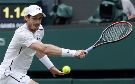 Andy Murray of Britain returns to Liam Broady of Britain during their men's singles match on day two of the Wimbledon Tennis Championships in London Tuesday