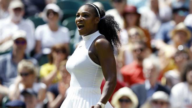 Serena Williams of the U.S celebrates after beating Elena Vesnina of Russia inter women's singles match on day eleven of the Wimbledon Tennis Championships in London