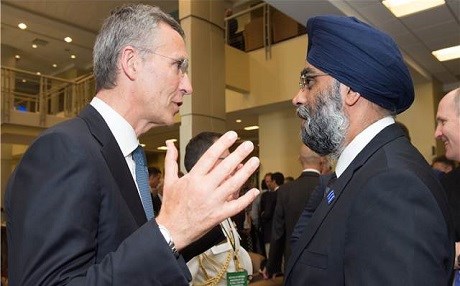 Canada’s Defence Minister Harjit Sajjan talks with NATO Secretary General Jens Stoltenberg at a meeting of members of the anti-ISIS coalition in Washington on Wednesday