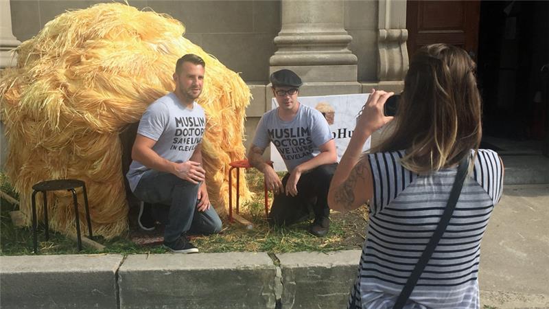 Anti-Trump protesters Tommy Noonan and Douglas Cameron posed in front of the Trump Hut