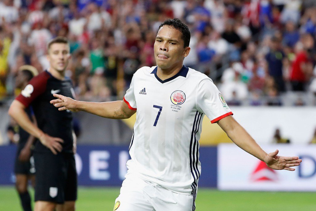 GLENDALE AZ- JUNE 25 Carlos Bacca #7 of Colombia celebrates his first half goal ahead of Matt Besler #5 of United States during the 2016 Copa America Centenario third place match at University of Phoenix Stadium