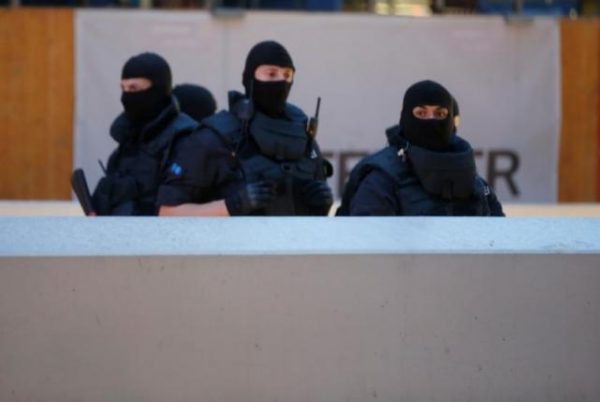 Special force police officers stand guard at an entrance of the main train station following a shooting rampage at the Olympia shopping mall in Munich. REUTERS  Michael Dalder