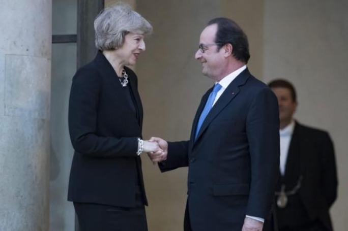 At their first meeting in Paris Francois Hollande warned Theresa May about immigration and free market