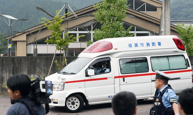 An ambulance outside the facility for disabled people where at least 19 people have been killed and dozens injured in a knife attack in Sagamihara outside Tokyo