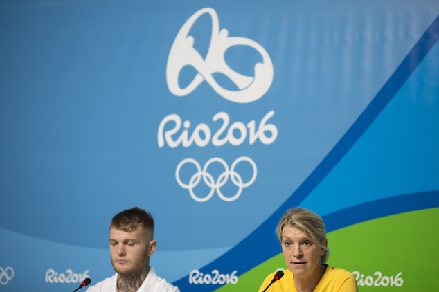 Australia's delegation head Kitty Chiller right and boxer Daniel Lewis listen to questions during a press conference in the Olympic Park in Rio de Janeiro