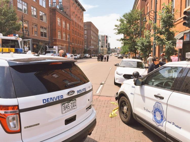 Authorities in Denver are seen securing the 1500 block of Wynkoop as they look for an active shooter on Tuesday