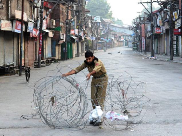 A view of a deserted road during the curfew in Srinagar