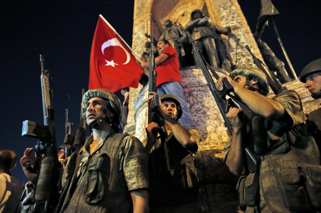 Turkish soldiers secure the area as supporters of Turkey's President Recep Tayyip Erdogan protest in Istanbul's Taksim square early Saturday