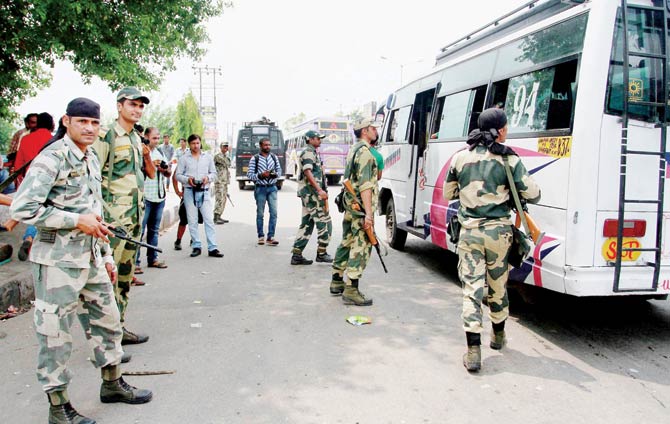 BSF and J&K police search vehicles after a constable stabbed a jawan and fled with weapons at Beli Azmat post in Jammu yesterday. Pic  PTI