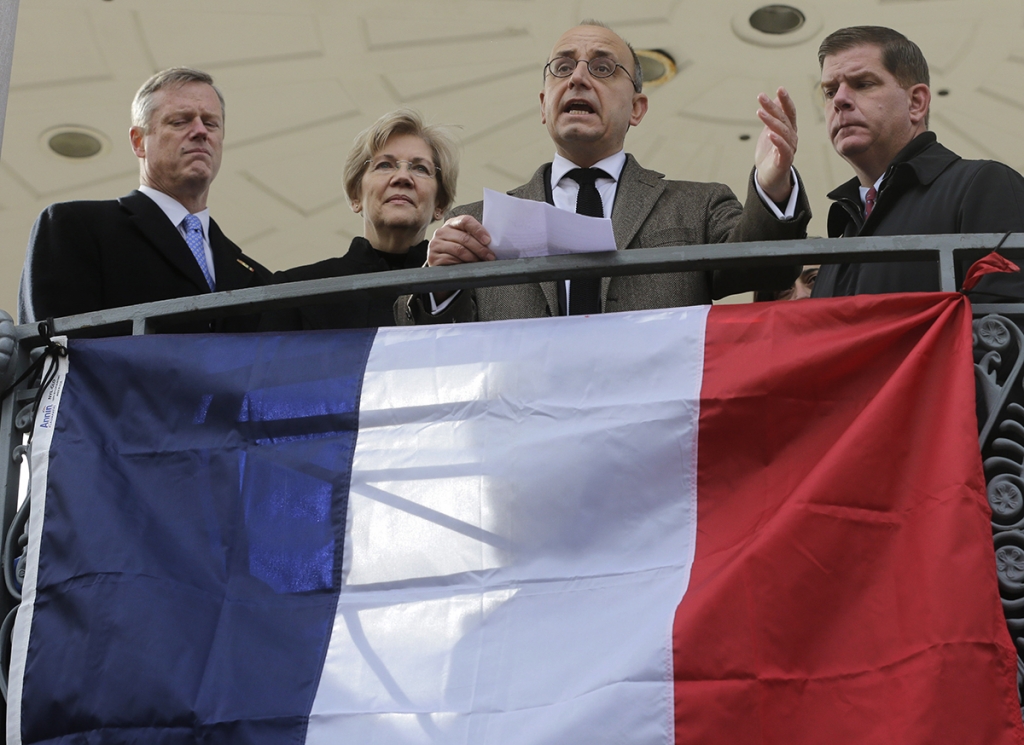 Baker Sen. Elizabeth Warren and Boston Mayor Marty Walsh gather in the Common following November’s attacks in Paris