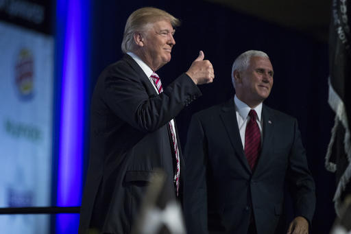 Republican presidential candidate Donald Trump and his running mate Republican Vice Presidential candidate Indiana Gov. Mike Pence arrive for the Veterans of Foreign Wars convention Tuesday