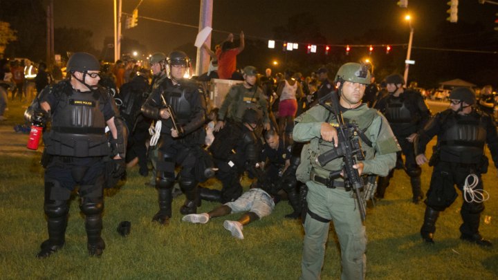 Baton Rouge police rush the crowd of protesters and start making arrest