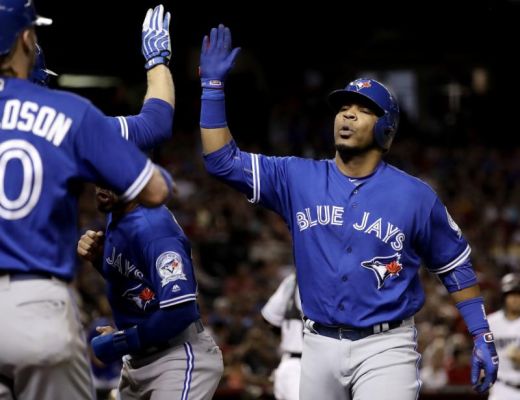 Toronto Blue Jays Edwin Encarnacion high fives teammates