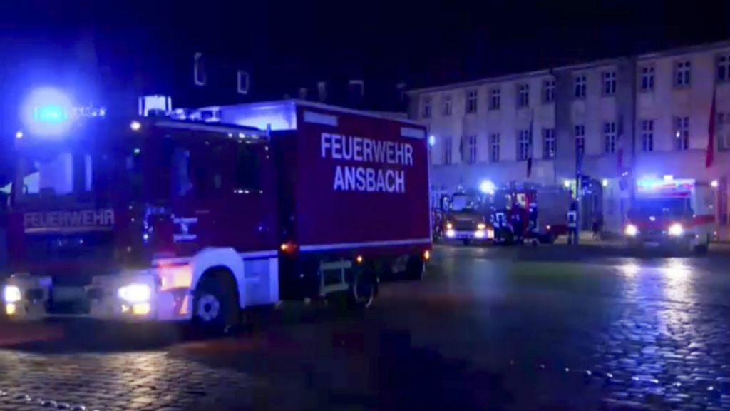 In this image taken from video fire trucks and ambulances stand in the city center of Ansbach near Nuremberg southern Germany Monday morning