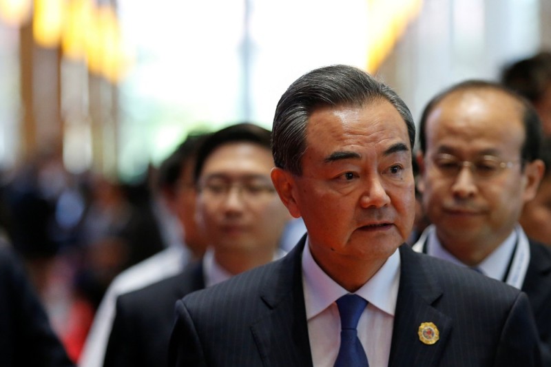 China's Foreign Minister Wang Yi speaks to media at the sidelines of the ASEAN foreign ministers meeting in Vientiane Laos