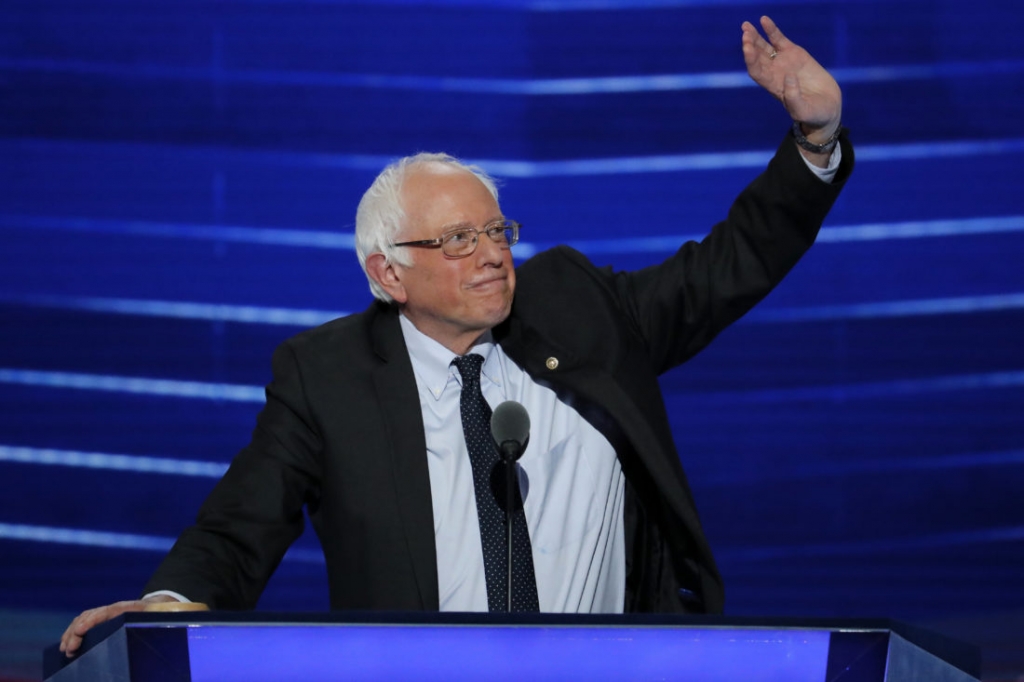 Former Democratic presidential candidate Sen. Bernie Sanders I-Vt. waves to delegates during the first day of the Democratic National Convention in Philadelphia, Monday