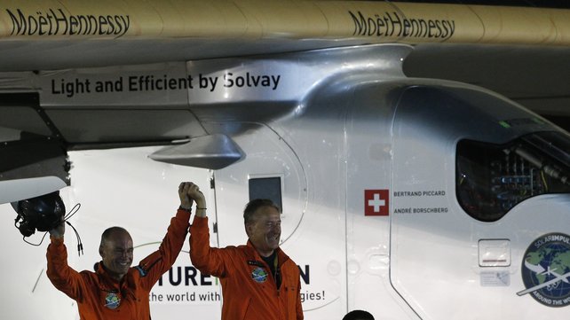 Bertrand Piccard and André Borschberg are greeted upon Piccard's arrival in Abu Dhabi